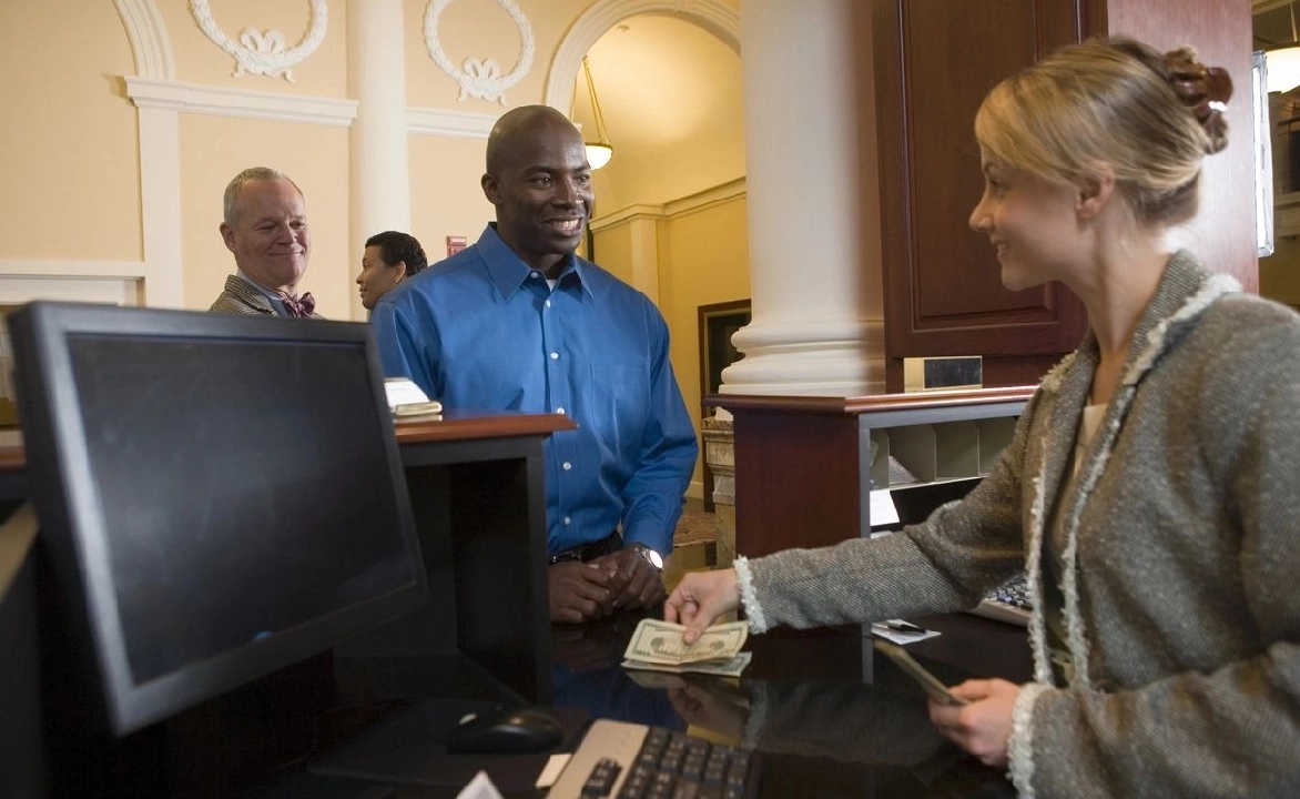 A man and woman at the front of an office.