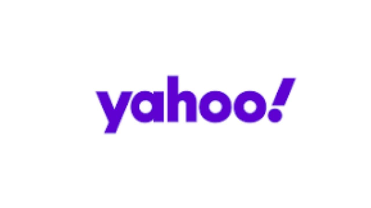 A purple yahoo logo on top of a white background.