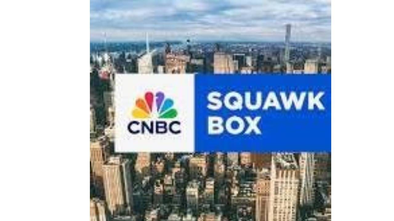 A picture of the new york skyline with cnbc and squawbox logos.